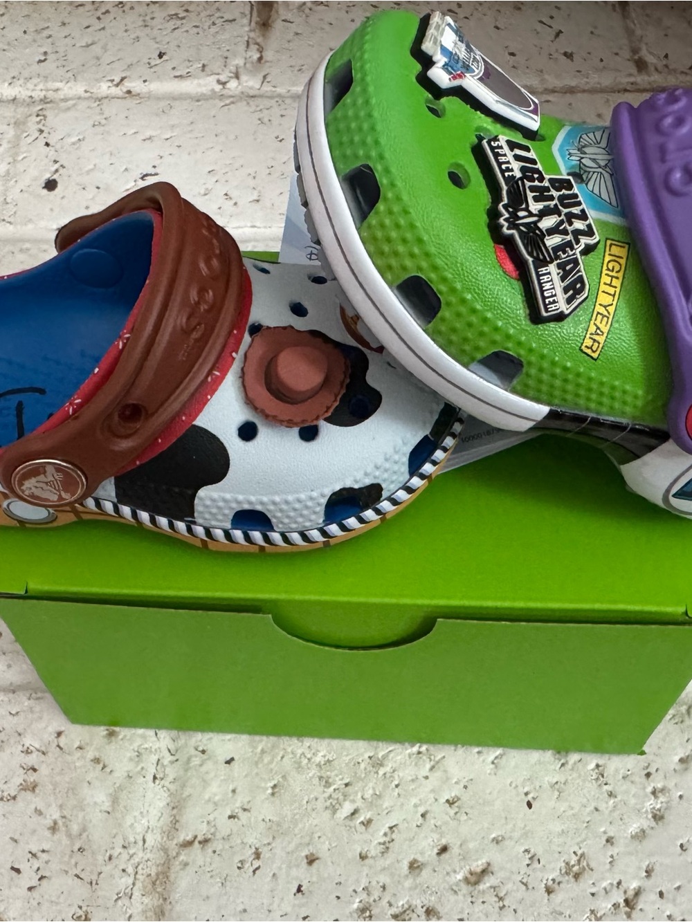 CROCS Kids Toy Story Woody & Buzz Lightyear Clogs - White/Brown & Green/Purple - Picture 2 of 2
